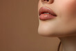 Against a backdrop of flawless skin, the image highlights the natural beauty of a woman's lips. Their soft, supple texture and subtle coloration enhance her overall allure.