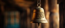 Traditional Temple Vibes: A Rustic Bell Suspended On Weathered Wooden Wall