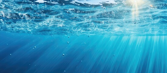 Poster - Vibrant Sunlight Reflecting on Rippling Blue Water Surface with Bubbles and Sparkling Rays
