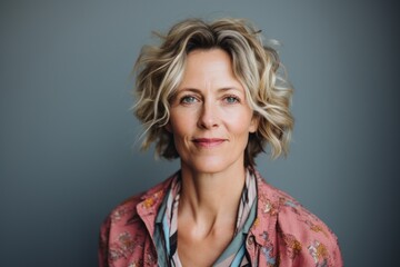 Wall Mural - Portrait of a beautiful middle-aged woman with short wavy hair.