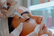 Close-up of a woman undergoing a hyaluronic acid procedure in a beauty salon