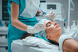 Professional cosmetologist doing beauty procedure on the face of a young woman
