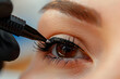 Eyelash extension procedure in a beauty salon. Close-up
