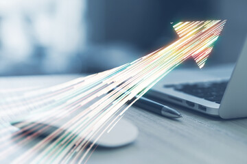 Canvas Print - Close up of laptop on desk with creative high-speed motion arrow on blurry background. Dynamic energy and technology concept. Double exposure.