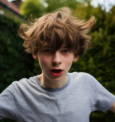 Poster - A young boy with a messy hair cut standing in front of a fence. Generative AI.