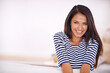 © Arcurs Corp/peopleimages.com - Female person, portrait and smile in living room or sofa, relaxing and comfortable in lounge. Woman, enjoying and resting in couch for break or weekend with casual outfit, happy and leisure at home