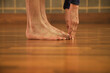 © fStop - Mature Man Practicing Yoga, Standing forward bend pose, Low section
