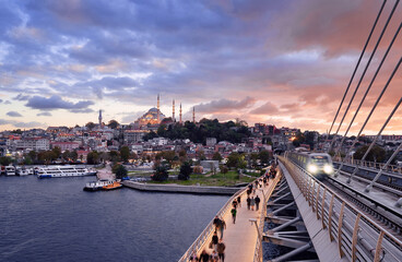 Wall Mural - Istanbul metro station on the modern bridge on Golden Horn at sunset time.