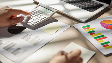 Desk with calculators for calculating, managing and
analyzing economic profits and losses.