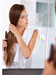 Canvas Print - Mirror, woman and brush hair in home bathroom for beauty, care or morning routine with cosmetics. Reflection, hairstyle and serious person combing for cleaning, hygiene and treatment for wellness