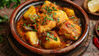 Traditional homemade fish tajin stew with potatoes.