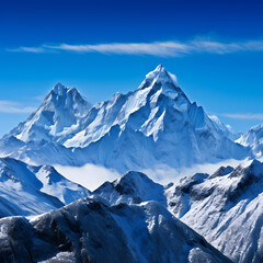 Sticker - Snow-covered mountain peaks against a clear blue sky