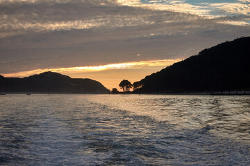 Wall Mural - Cies Islands in Galicia Spain seen from the boat returning to Vigo at sunset.