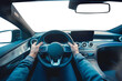 Man hands holding steering wheel. Driving a car. 1st person perspective. Cockpit and steering wheel view angle. Back view. Transparent PNG background. Pen tool premium cutout.