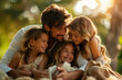 Father embraces his smiling children during a warm sunset outdoors
