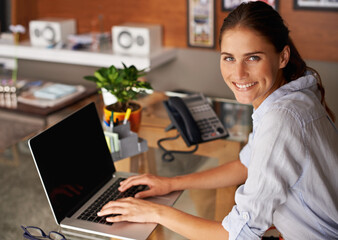 Businesswoman, laptop and portrait in home office professional, freelance and working in house. Female person, happy and smile with computer or typing, research and technology for connectivity