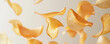 © cac_tus - Suspended Potato Chips on Beige Background