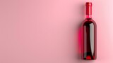 Fototapeta  - A bold red wine bottle stands against a soft pink background, showcasing modern simplicity and style.