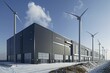 The factory's exterior showcases wind turbines and optimized building design for reduced environmental impact.