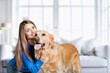 © BillionPhotos.com - Happy mom play with adorable dog at home.