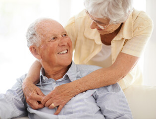 Poster - Couple, senior and hug or love in looking, home and relax together for bonding and smile. Elderly people, embrace and care in marriage or relationship in retirement, couch and security in house