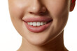 © master1305 - Close-up of woman's lower face, highlighting smooth skin, plump lips and white teeth. Model posing against white background. Concept of natural beauty, cosmetology, cosmetics, skin care, dental care