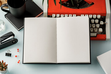 Sticker - Hardcover book and vintage typewriter on white desk