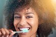 © Mapodile M/peopleimages.com - Black woman, portrait and toothbrush for teeth cleaning in bathroom, dental health and self care closeup for fresh breathe. Orthodontics, oral hygiene and morning routine with toothpaste at home