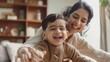 A joyful scene unfolds in an Indian household as a happy mother and her 5-year-old son share quality time together