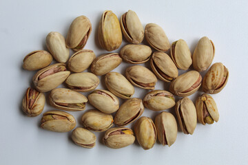 Salted pistachio, on white background, flat lay or top view