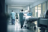 Fototapeta  - Medical team transporting patient in hospital corridor