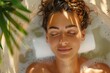 © Atthasit - Woman relaxing in a bubble bath with plant shadows on her face. Self-care and relaxation concept. Close-up with natural lighting