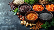 Vegan food with nuts, beans, greens and seeds. A gray background with copy space.
