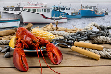 Wall Mural - Lobsters on a plate on a seaside warf with driftwood and ropes
