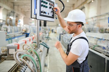 Wall Mural - Factory worker. Man working on the production line