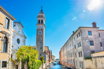 Wall Mural - View of campanile of church San Giorgio dei Greci and canal on a sunny day. Venice, Italy