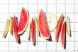 Summer concept with sliced melon and watermelon pieces put in a raw