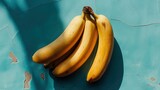Fototapeta  - Banany na niebieskim stole