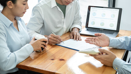 Poster - Asian couple signing on contract for investment after meeting with financial advisor for discussion new business