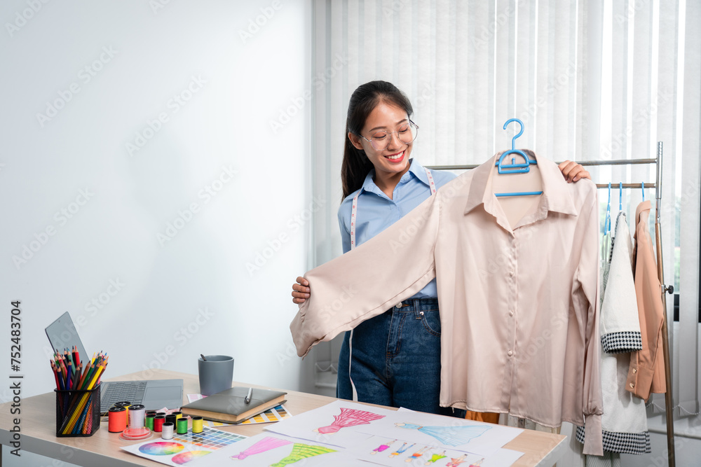 Women fashion designer stylist working and thinking decide choosing ...