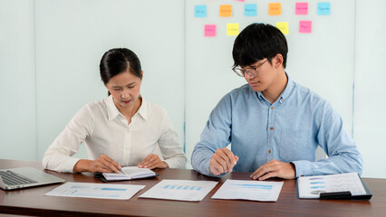 Aufkleber - Business executive team brainstorm and takes notes on keyword about a new business project for marketing planning together in the office