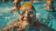 Mujer madura disfrutando de una clase de aqua fitness en una piscina. Concepto de estilo de vida saludable.
