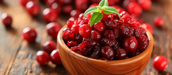 Poster - Rustic wooden bowl overflowing with fresh ripe cranberries and vibrant cranberry leaves