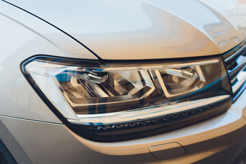 Wall Mural - led headlight of car, image close-up part of automobile.