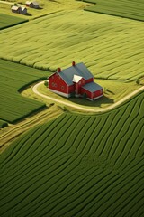 Aufkleber - A picturesque red house standing in the middle of a vibrant green field. Suitable for real estate, countryside living concepts