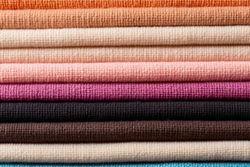 Poster - A detailed view of a stack of fabric, suitable for textile industry projects