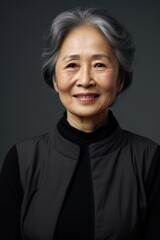 Poster - A woman with gray hair wearing a black shirt. Suitable for various concepts and designs