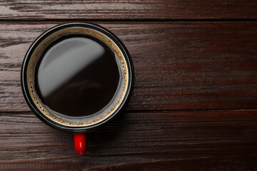 Poster - Cup of aromatic coffee on wooden table, top view. Space for text