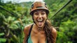 A woman with a climbing helmet laughs joyfully outdoors, suggesting thrill and adventure