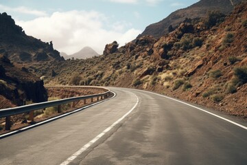 Leinwandbilder - Serene landscape with empty road and distant mountain view. Ideal for travel and adventure concepts